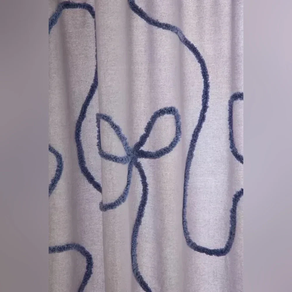 Wild Bows Tufted Shower Curtain from UO Home Cornflower Blue